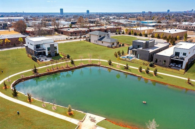 birds eye view of property with a water view