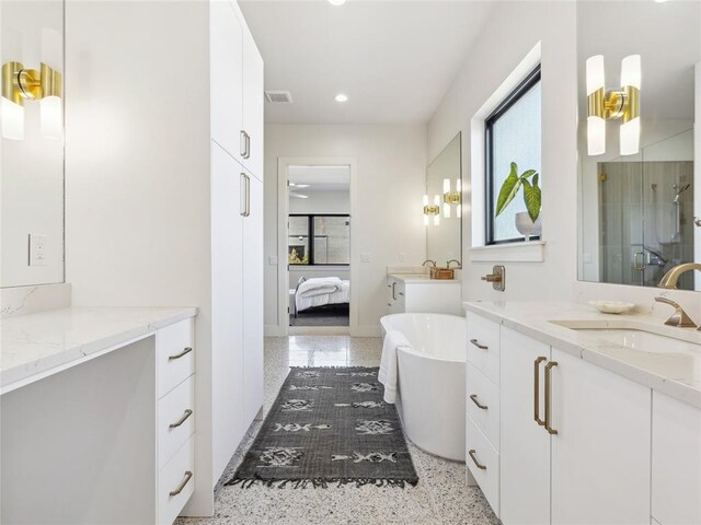 834 NW 72nd St, Oklahoma City, OK 73116 - ensuite bathroom featuring connected bathroom, a sink, a shower stall, a freestanding bath, and recessed lighting