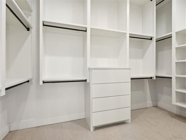 834 NW 72nd St, Oklahoma City, OK 73116 - walk in closet featuring light carpet