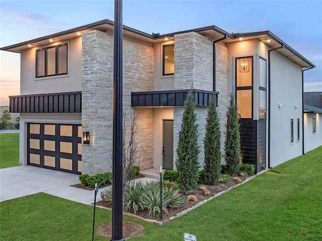834 NW 72nd St, Oklahoma City, OK 73116 - modern home with driveway, stone siding, stucco siding, a garage, and a yard