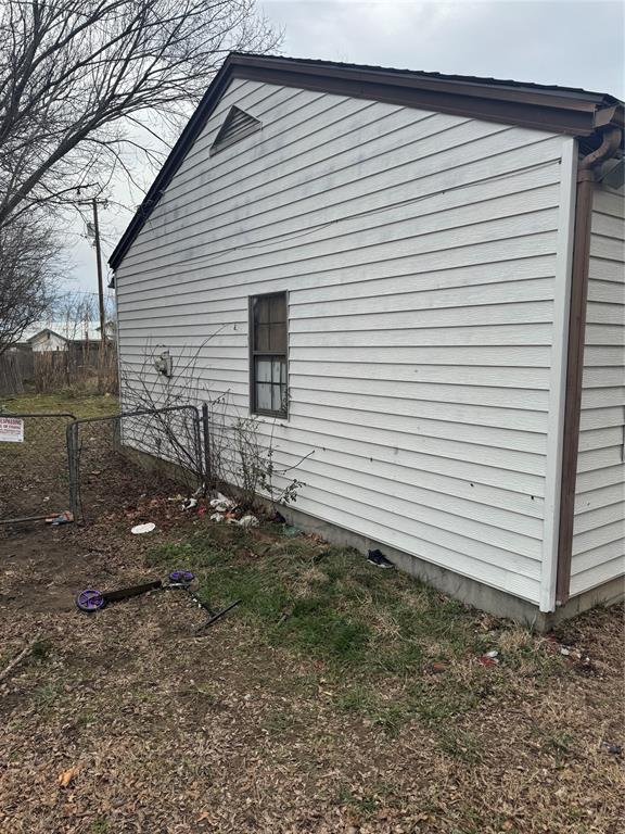 view of home's exterior with fence