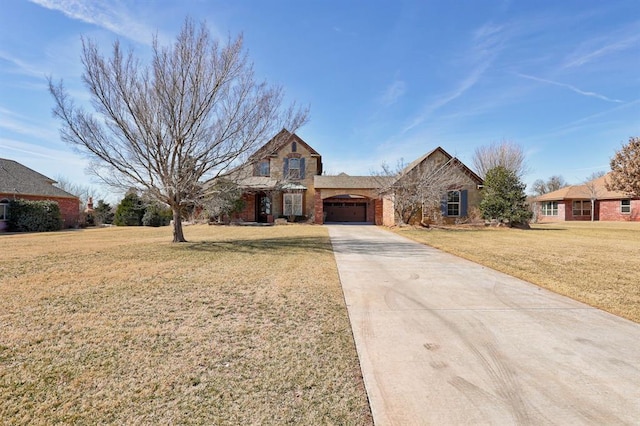 traditional-style home with a front yard, brick siding, driveway, and an attached garage