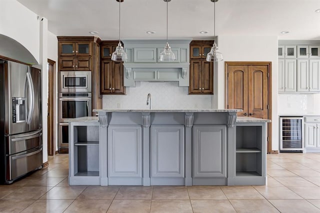 kitchen with light stone counters, open shelves, backsplash, appliances with stainless steel finishes, and beverage cooler