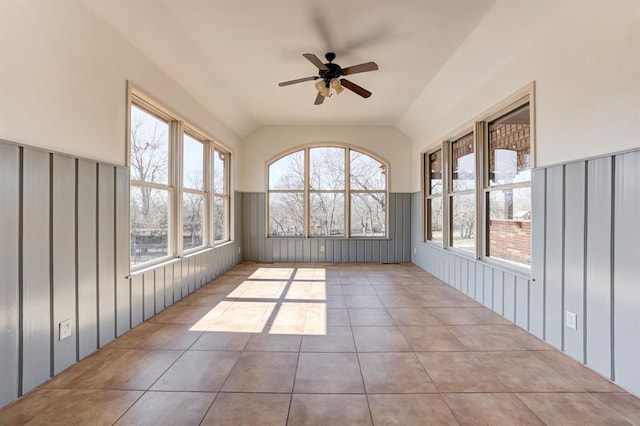 unfurnished sunroom featuring lofted ceiling and ceiling fan