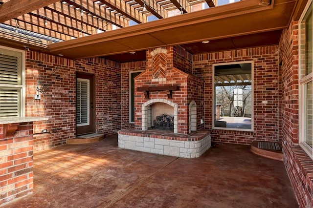 view of patio / terrace with an outdoor brick fireplace and a pergola