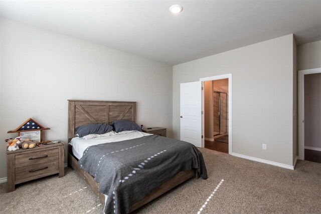 carpeted bedroom featuring baseboards