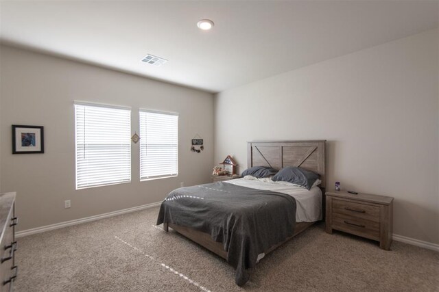 bedroom featuring carpet, visible vents, and baseboards