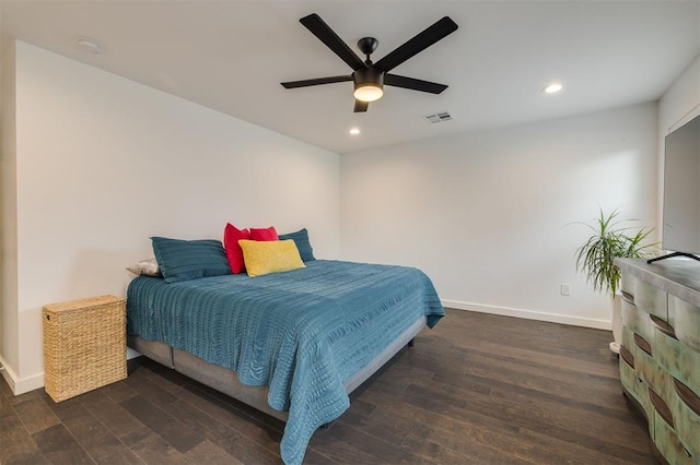 bedroom with dark wood-style flooring, recessed lighting, visible vents, and baseboards