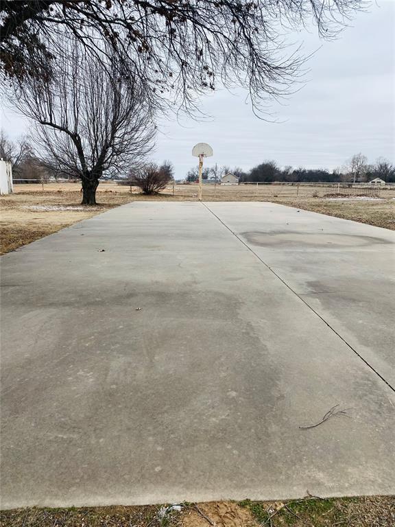 view of yard with community basketball court