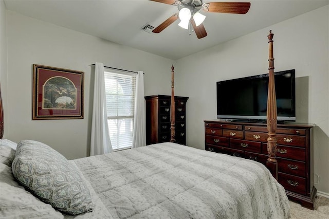 carpeted bedroom with ceiling fan and visible vents