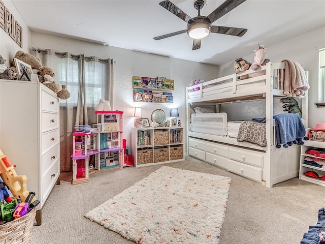 bedroom with light carpet and a ceiling fan