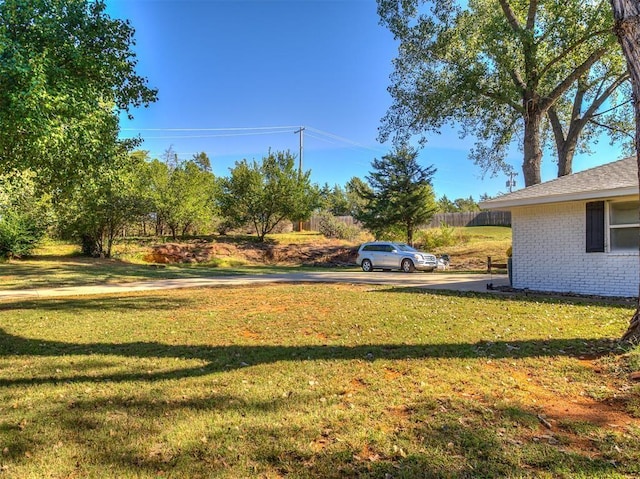 view of yard featuring fence