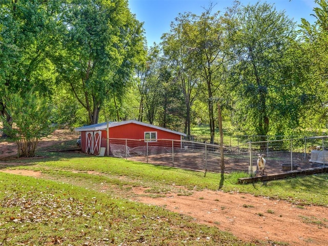 exterior space with a lawn and fence