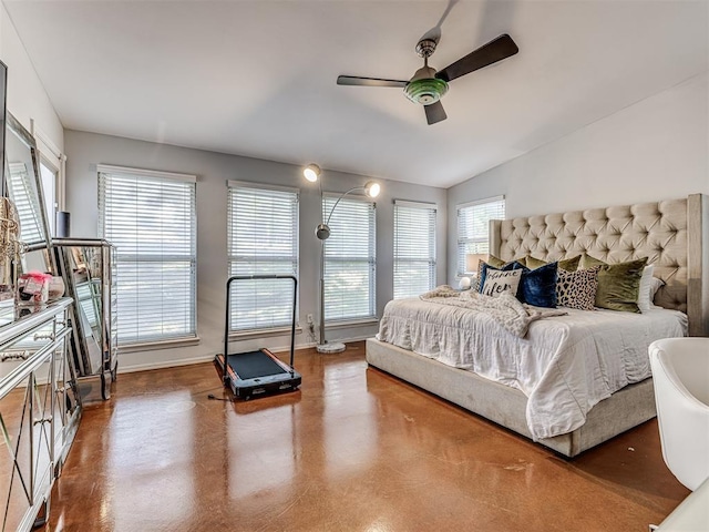 bedroom with lofted ceiling, ceiling fan, multiple windows, and baseboards