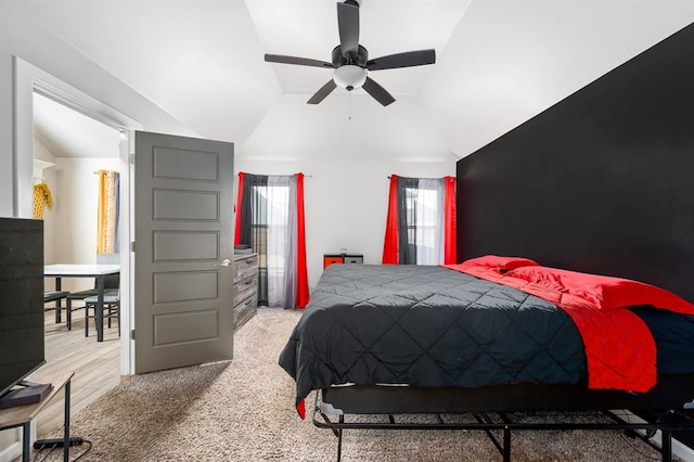 bedroom featuring carpet floors, lofted ceiling, and ceiling fan