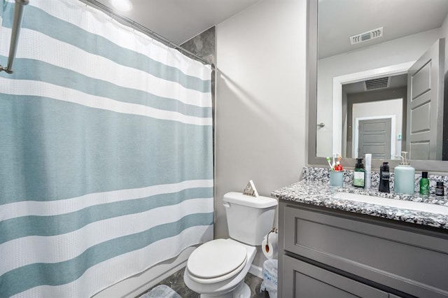 bathroom featuring toilet, curtained shower, vanity, and visible vents