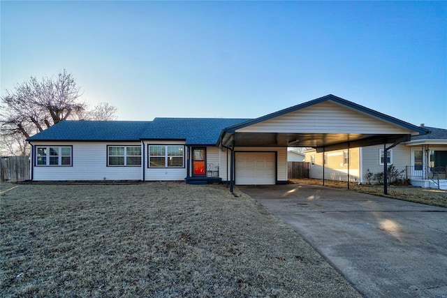 ranch-style house with a garage, driveway, entry steps, an attached carport, and a front lawn