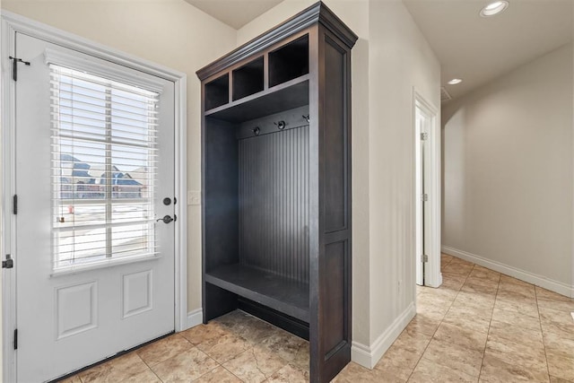 mudroom featuring light tile patterned floors, baseboards, and recessed lighting