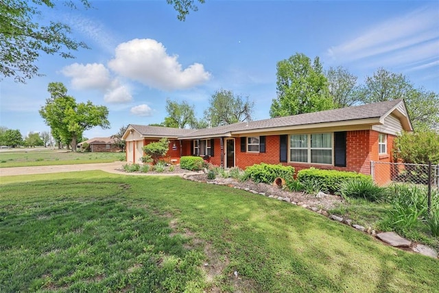 406 S Pine St, Crescent, OK 73028 - single story home featuring a front lawn, brick siding, concrete driveway, an attached garage, and fence