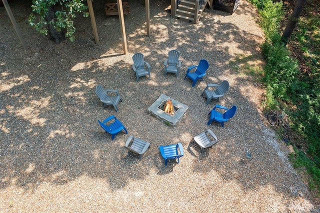 exterior details featuring a fire pit and a flat roof