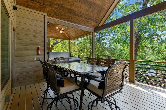 wooden terrace with outdoor dining area