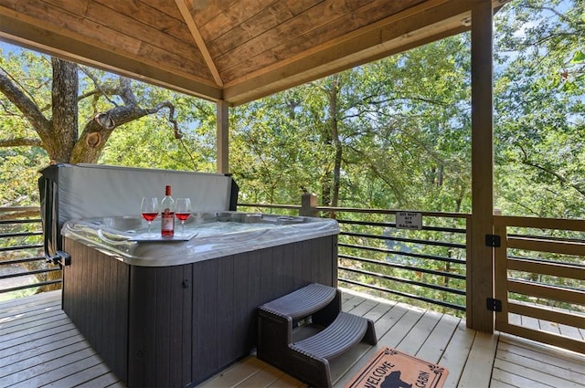 wooden terrace with a hot tub