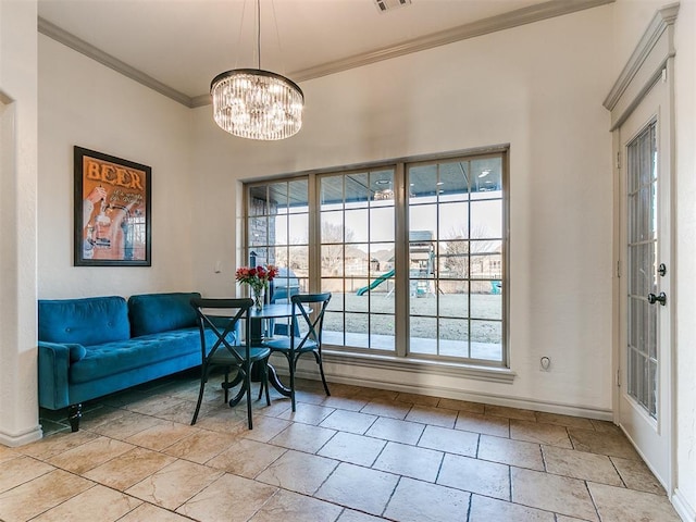 interior space with baseboards, ornamental molding, visible vents, and an inviting chandelier