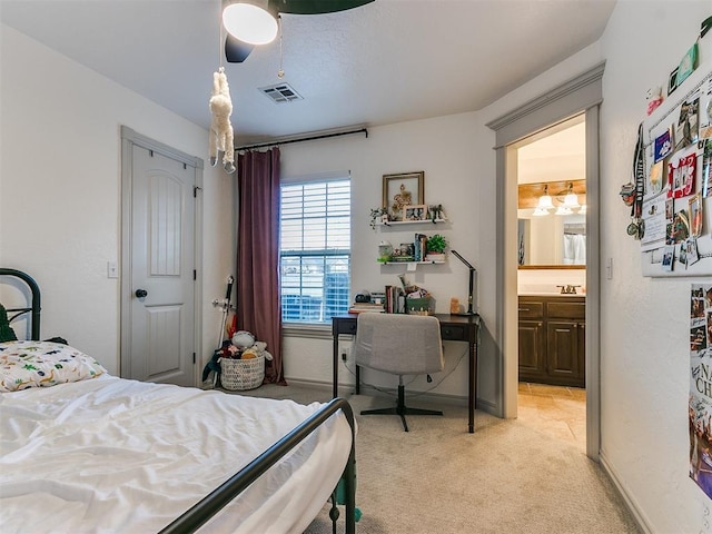 bedroom featuring light colored carpet, ceiling fan, visible vents, and baseboards