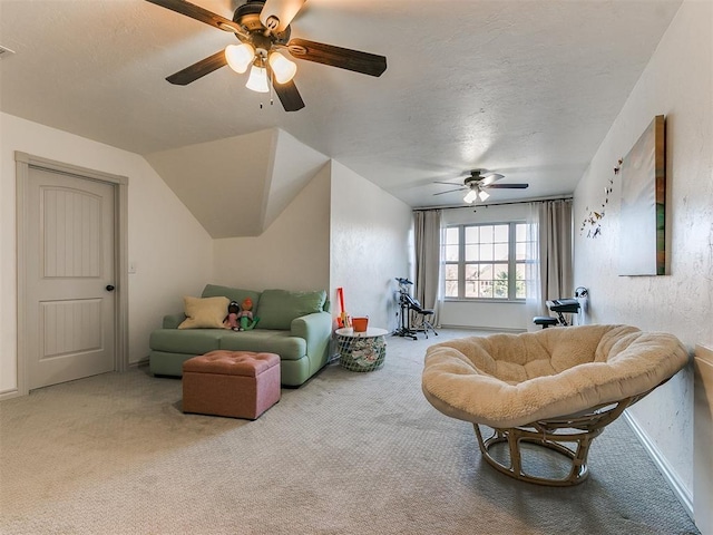 carpeted living area featuring a ceiling fan, visible vents, and a textured ceiling