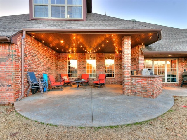 view of patio featuring an outdoor kitchen