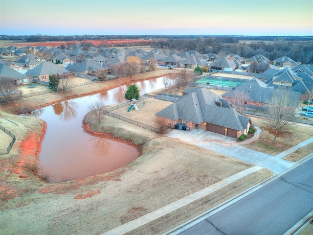 bird's eye view with a water view and a residential view