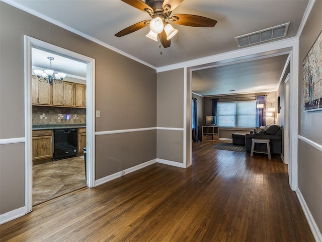 interior space featuring crown molding, visible vents, dark wood-type flooring, baseboards, and ceiling fan with notable chandelier