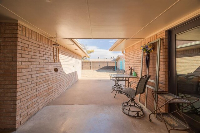 view of patio featuring fence