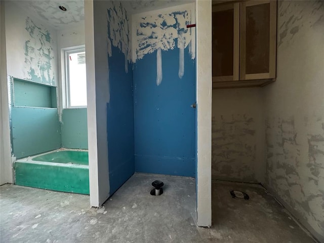 bathroom with concrete flooring