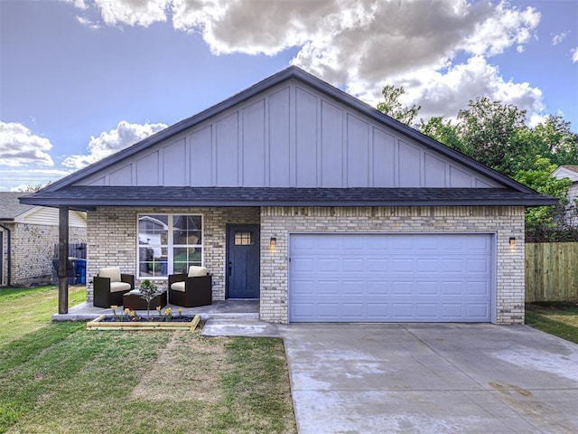 4419 Meadowpark Dr, Midwest City, OK 73110 - view of front facade with concrete driveway, a front yard, brick siding, and board and batten siding