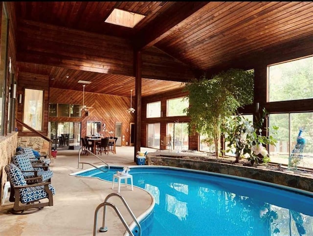 indoor pool featuring a patio