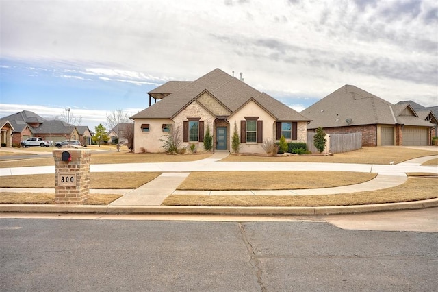 french country inspired facade featuring fence