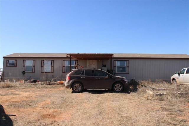 view of front of home with a carport