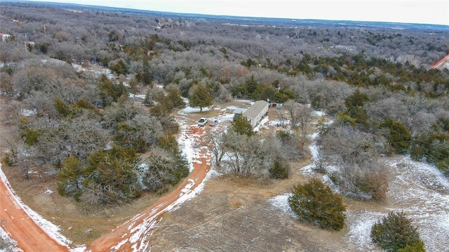 birds eye view of property featuring a view of trees