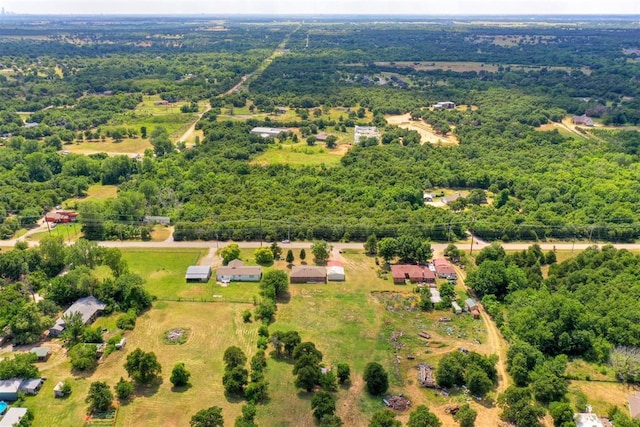 birds eye view of property with a wooded view