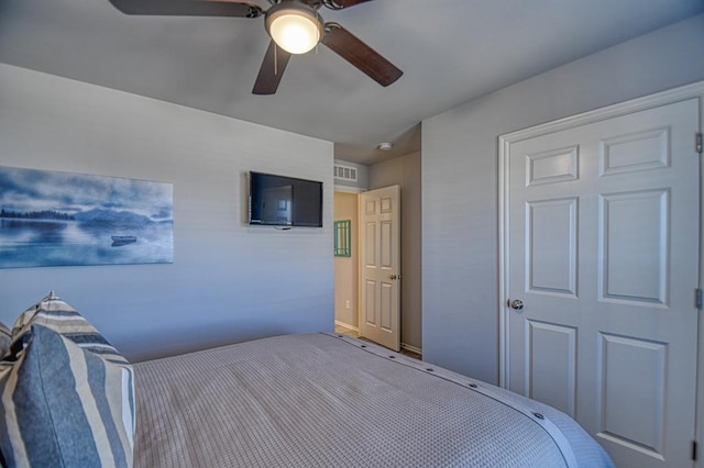 bedroom with visible vents and a ceiling fan