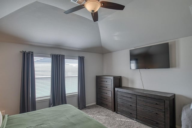 bedroom with ceiling fan, vaulted ceiling, and light colored carpet