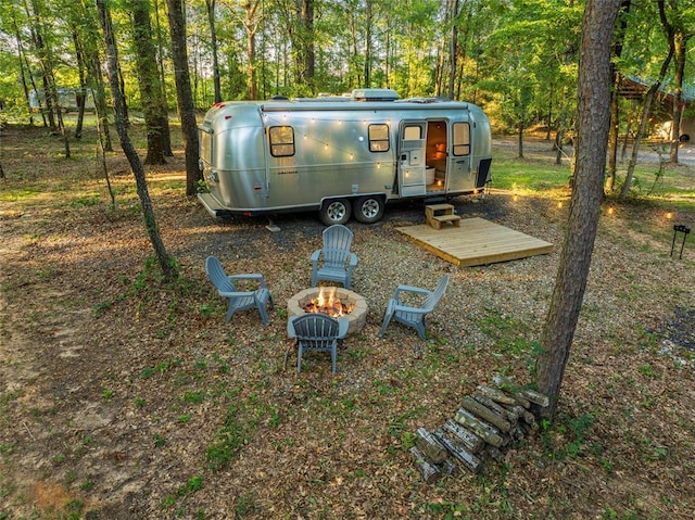 view of yard with an outdoor fire pit