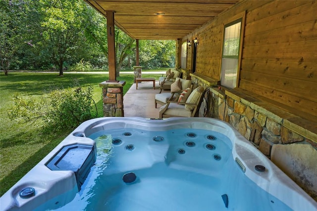 view of patio / terrace featuring a hot tub