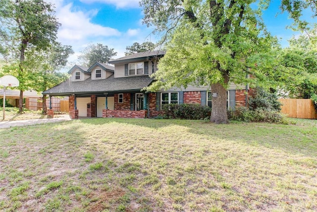 view of front facade with brick siding, fence, and a front lawn