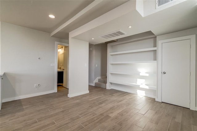 unfurnished bedroom featuring light wood finished floors, recessed lighting, visible vents, and baseboards