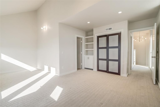 unfurnished bedroom with baseboards, light colored carpet, visible vents, and recessed lighting