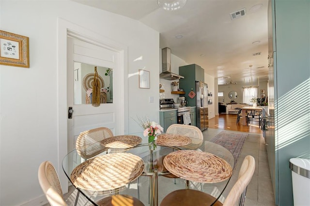 dining room featuring visible vents