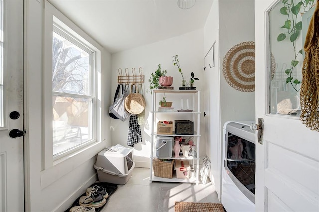 mudroom with heating unit, tile patterned flooring, and baseboards