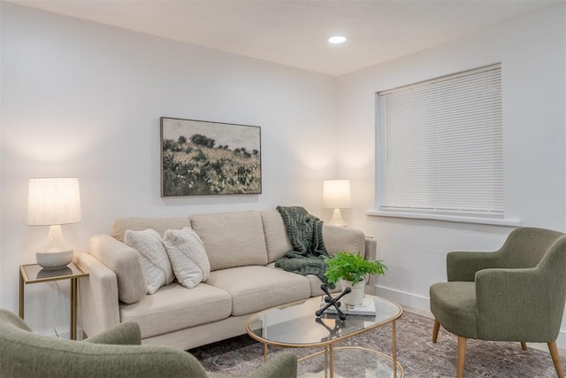 living area with recessed lighting, baseboards, and wood finished floors